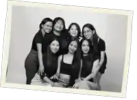 a black and white photo of a group of women