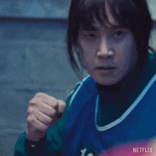 a close up of a person 's face with the word netflix on the bottom right