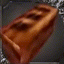 a close up of a person 's ear in a pixel art style .