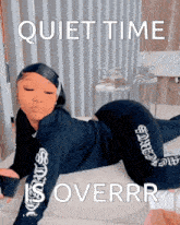 a woman is laying on her stomach on a bed with the words quiet time overrr written above her