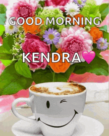 a picture of flowers and a cup of coffee with the name kendra