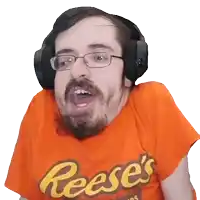 a man wearing headphones and an orange reese 's shirt makes a funny face