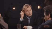 Christopher Nolan Scratching GIF - Christopher Nolan Scratching Poker Face GIFs