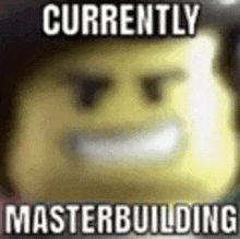 a blurred image of a lego man with the words `` currently masterbuilding '' .