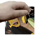 a close up of a person 's hand holding a cartoon character 's head .
