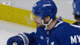 a hockey player wearing a helmet with oreo written on it