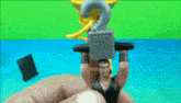 a person is holding a toy figure of a man lifting a heavy object over his head .