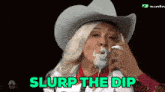 a woman in a cowboy hat with a spoon in her mouth and the words slurp the dip above her