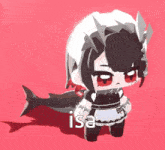 a little girl in a maid costume is standing next to a shark with the word isa written on it .