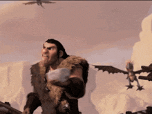 a man in a fur coat holds a small dragon in his hand