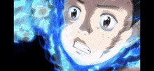 a close up of a person 's face with blue flames behind him