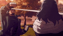 a man and a woman are fighting with a sword