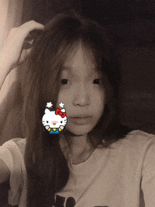 a girl with hello kitty on her face