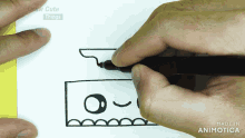 a person is drawing a cartoon with a marker and the words draw cute things are visible in the corner