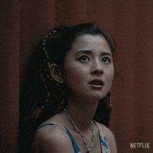 a close up of a woman 's face with netflix written on the bottom right