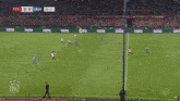 a soccer game between fey and aja is going on