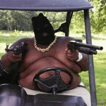 a fat man in a ski mask is driving a golf cart while holding two guns .