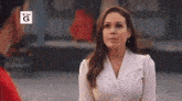 a woman in a white shirt is looking at a man .