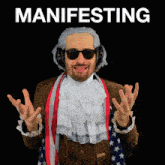 a man wearing a wig and headphones stands in front of a black background that says manifesting
