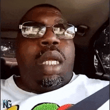 a man wearing sunglasses and a shirt that says nc