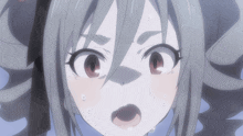a close up of a girl 's face with a surprised expression