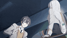 a boy and a girl are standing next to each other in a dark room