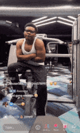 a man is sitting on a machine with his arms crossed