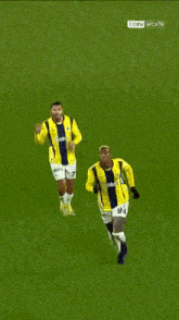 a soccer player with the number 94 on his shorts is running on a field