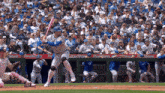 a baseball game is being played in front of a crowd with a sign that says fred meyer on it