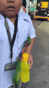 a boy with a lanyard around his neck that says ' sydney institute of technology ' on it