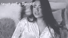 a black and white photo of a woman with the words " cause just a thought " below her