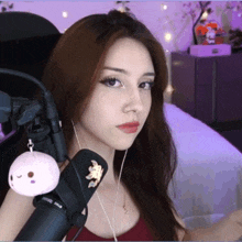 a woman is wearing headphones and a microphone that says rode