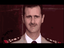 Assad Fake Smile GIF - Assad Fake Smile Laugh GIFs