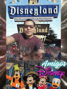 a picture of a man standing in front of a disneyland sign
