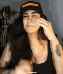 a woman wearing a hat that says " i love you "