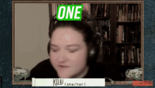 a woman wearing headphones has the word one on her face