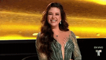 a woman in a very tight dress is smiling in front of a yellow background .