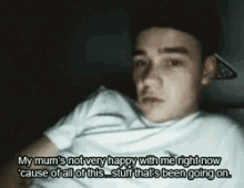 a picture of a young man with the caption " my mum 's not very happy with me right now cause of all of this "