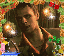 a picture of a man surrounded by pineapples and fireworks with tropical written on the top
