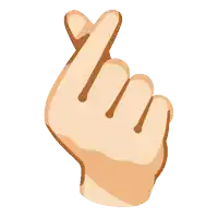 a hand making a heart sign with its fingers