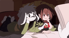 a cartoon drawing of a boy and a girl laying on a bed with uno sticks