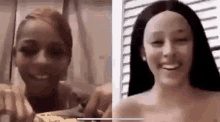 a woman with a wig on her head is smiling next to a woman without a wig on .