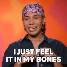 a man wearing a bandana and a denim shirt says i just feel it in my bones