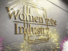 a gold sign that says women in the industry on it