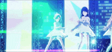 a group of anime girls are dancing on a stage in front of a large screen