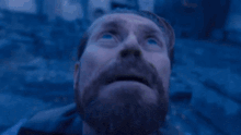 a man with blue hair is wearing a white jacket and blue shirt