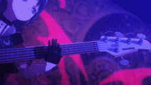 a girl is holding a guitar that says squier