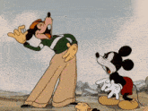 a cartoon of mickey mouse talking to a man