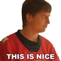 a man wearing a red jersey with the words this is nice written on it