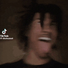 a man is sticking his tongue out in a tik tok